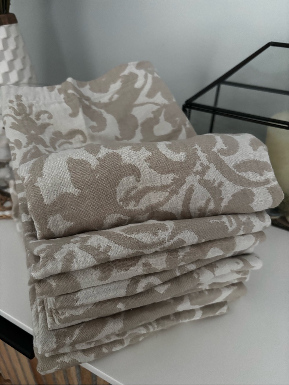 Pottery Barn Beige Damask Napkins on Blue-Green Background
